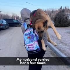 Woman Walks Miles Through War Carrying Her Elderly Dog